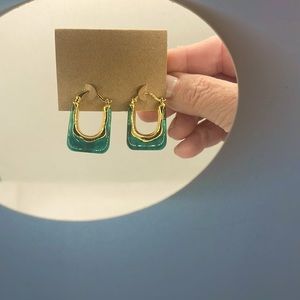 Green glass earring pierced